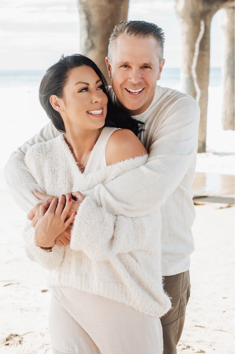 Christine and her husband Steve on the beach